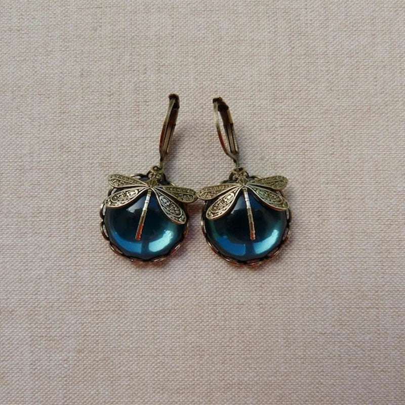 Dragonfly-shaped earrings in antique gold