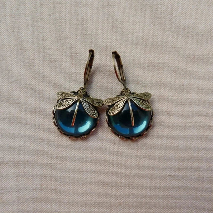 Dragonfly-shaped earrings in antique gold