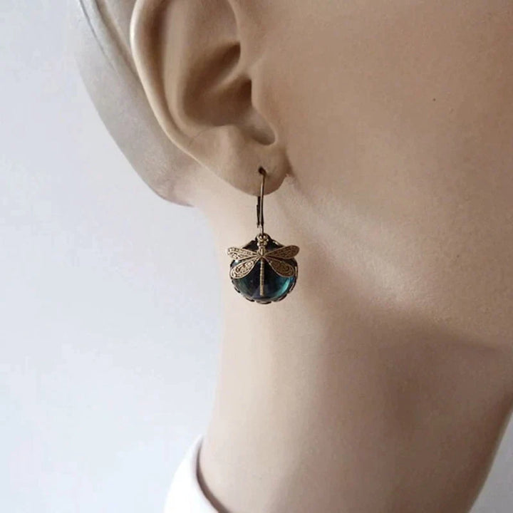 Dragonfly-shaped earrings in antique gold
